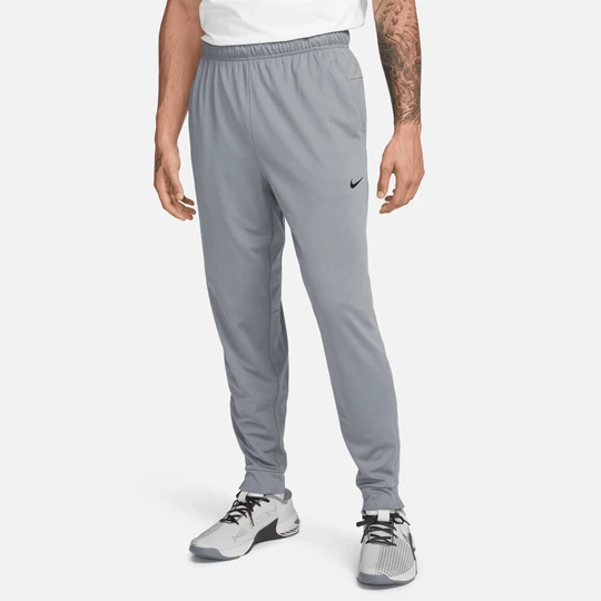 Zdjęcie produktu Męskie uniwersalne spodnie ze zwężanymi nogawkami Dri-FIT Nike Totality - Szary