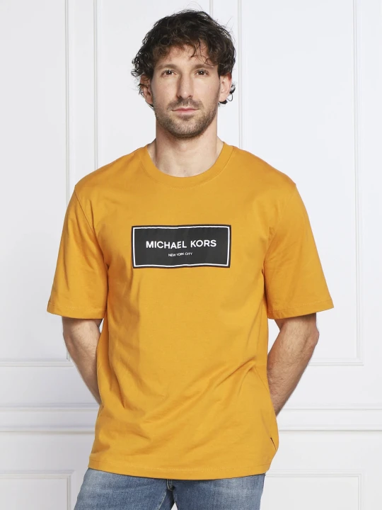 Zdjęcie produktu Michael Kors T-shirt FLAGSHIP LOGO | Regular Fit pomarańczowy