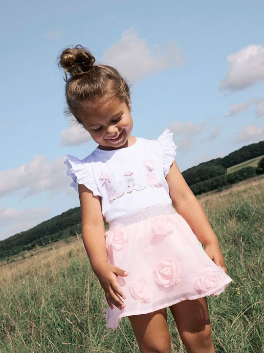 Zdjęcie produktu name it Koszulka "Hadia" w kolorze biało-jasnoróżowym rozmiar: 110