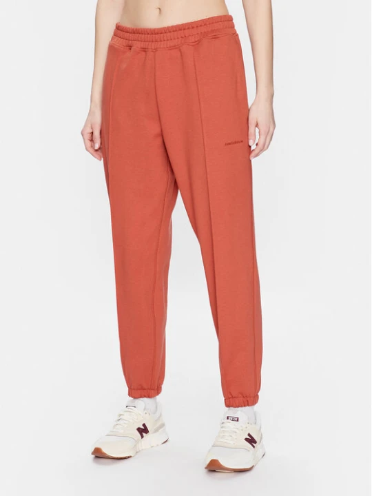 Zdjęcie produktu New Balance Spodnie dresowe Athletics Nature WP23553 Pomarańczowy Relaxed Fit