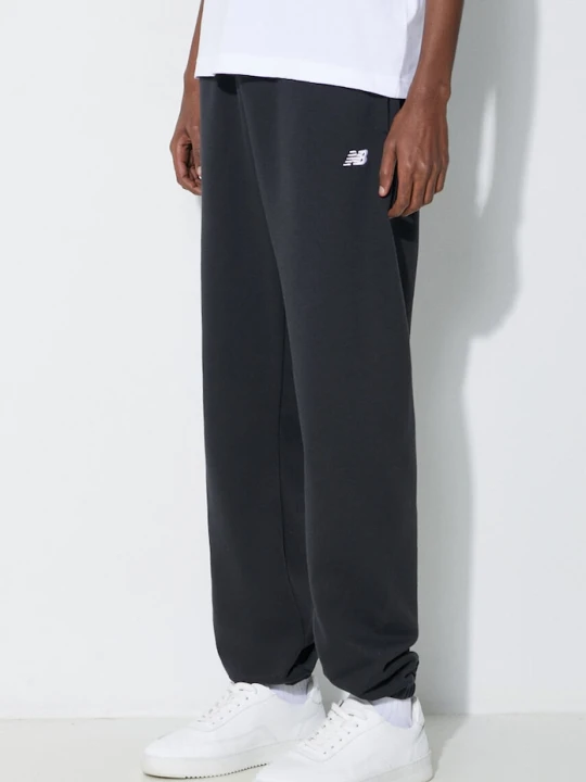 Zdjęcie produktu New Balance spodnie dresowe Essentials French Terry Jogger czarny