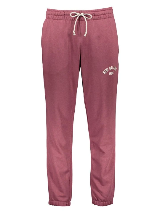 Zdjęcie produktu New Balance Spodnie dresowe "Essentials Varsity" w kolorze różowym rozmiar: XL