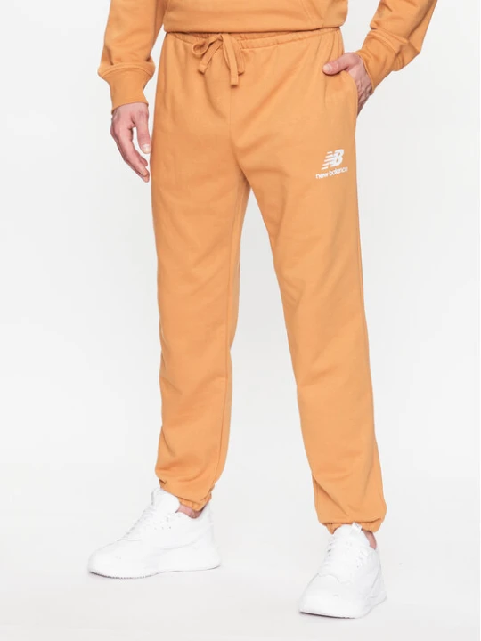 Zdjęcie produktu New Balance Spodnie dresowe MP31539 Żółty Regular Fit