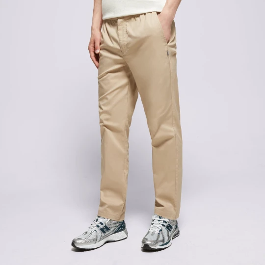 Zdjęcie produktu New Balance Spodnie Icon Twill Tapered beżowy