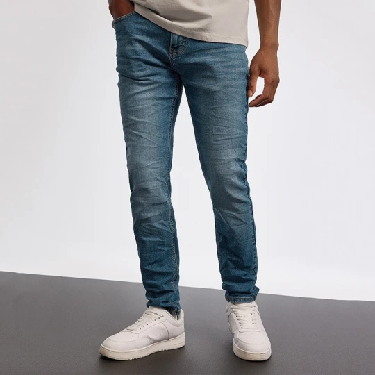 Zdjęcie produktu Niebieskie jeansy slim fit z efektem sprania House