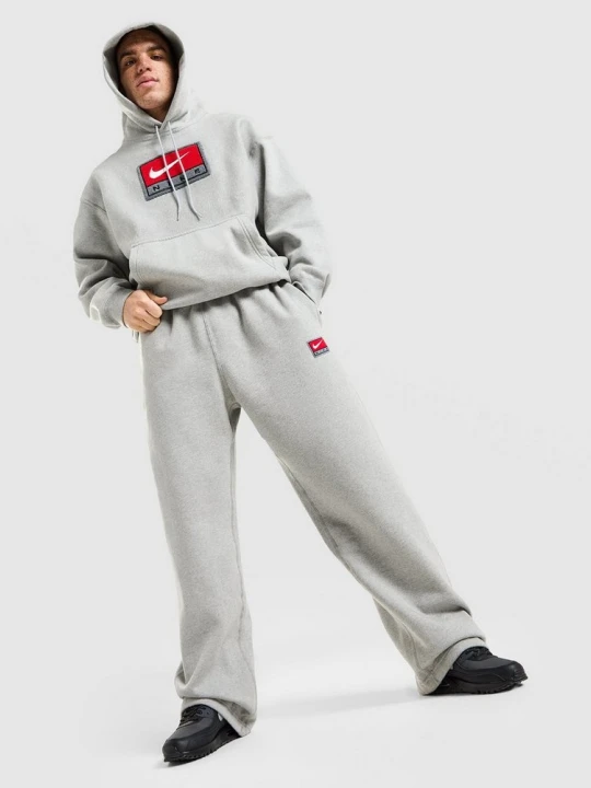 Zdjęcie produktu Nike Spodnie Nl Solo Swsh Bb Oh Gfx szary