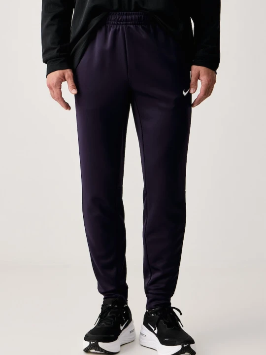 Zdjęcie produktu Nike spodnie treningowe męskie Hyverse UV Dri-FIT fioletowy