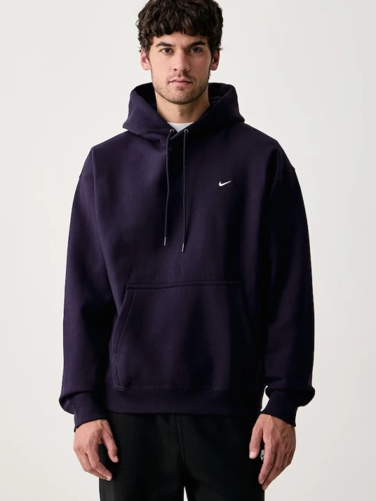Zdjęcie produktu Nike Sportswear bluza z kapturem męska z bawełną Solo Swoosh fioletowy