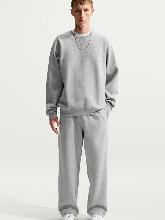 Zdjęcie produktu Nike Sportswear spodnie dresowe męskie z bawełną Solo Swoosh szary