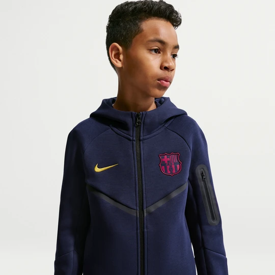 Zdjęcie produktu Piłkarska bluza z kapturem i zamkiem na całej długości dla dużych dzieci (chłopców) FC Barcelona Tech Fleece - Niebieski Nike