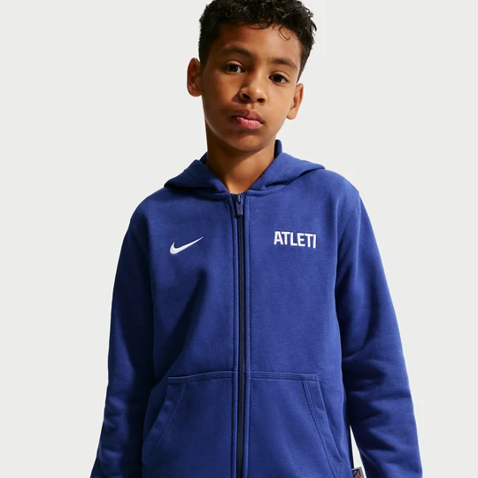 Zdjęcie produktu Piłkarska bluza z kapturem z dzianiny dresowej i zamkiem na całej długości dla dużych dzieci (chłopców) Nike Atlético Madryt Club - Niebieski