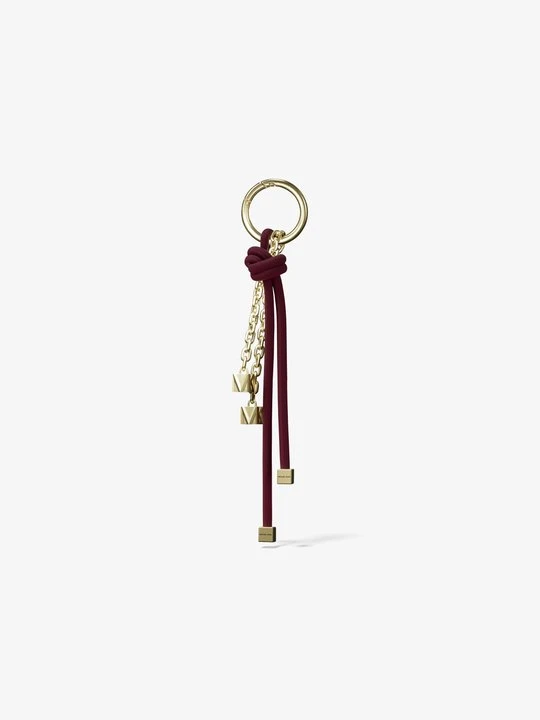 Zdjęcie produktu Pozłacana zawieszka z troczkiem Michael Kors MORWOWY (Purpurowy)