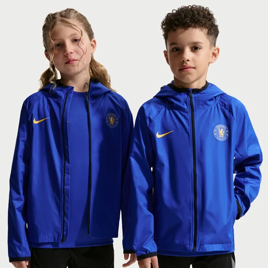 Zdjęcie produktu Przeciwdeszczowa kurtka piłkarska Storm-FIT z kapturem dla dużych dzieci Chelsea F.C. Academy Pro - Niebieski Nike
