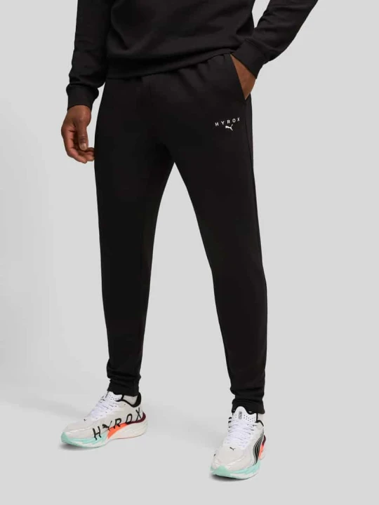 Zdjęcie produktu PUMA x HYROX - spodnie dresowe w kroju regular fit z materiału Cloudspun Czarny
