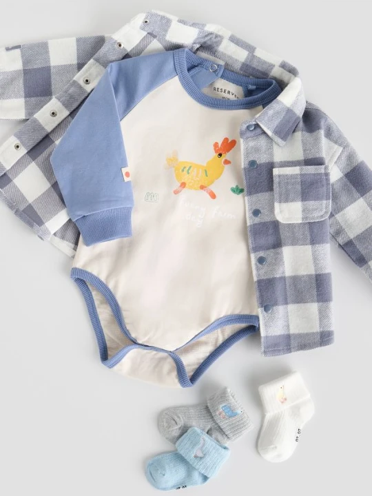Zdjęcie produktu Reserved - Bawełniane body z nadrukiem - kremowy