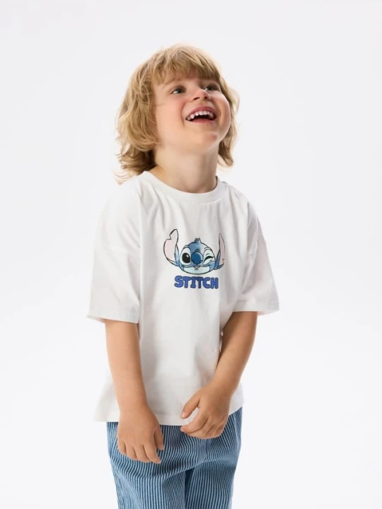 Zdjęcie produktu Reserved - Bawełniany t-shirt Lilo i Stitch - złamana biel