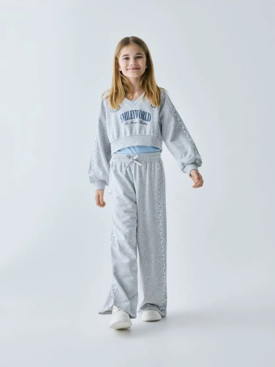 Zdjęcie produktu Reserved - Spodnie dresowe SmileyWorld® - jasnoszary