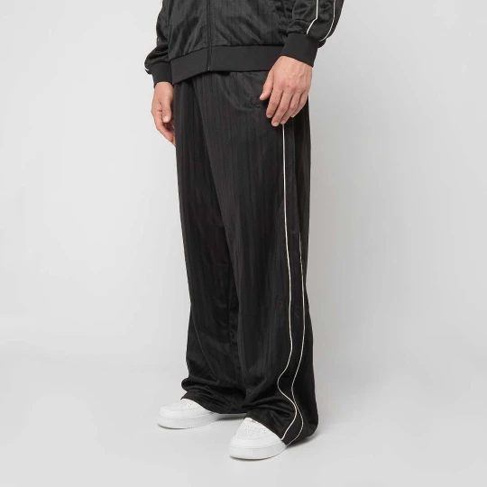 Zdjęcie produktu Signature Shadow Stripe Baggy Trackpants Karl Kani czarny