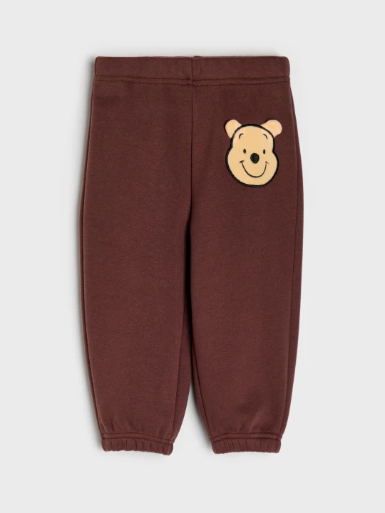 Zdjęcie produktu Sinsay - Bawełniane spodnie dresowe jogger z ociepleniem Winnie the Pooh - brązowy