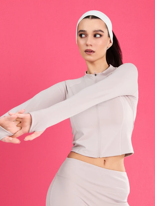 Zdjęcie produktu Sinsay - Rozpinana sportowa bluza ze stójką i otworami na kciuki Gym Hard - kremowy