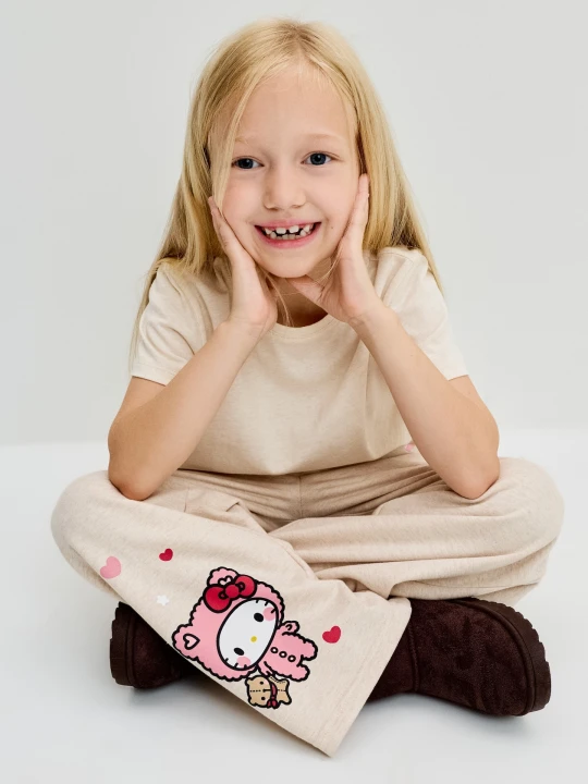 Zdjęcie produktu Sinsay - Spodnie dresowe wide leg z nadrukiem Hello Kitty - kremowy