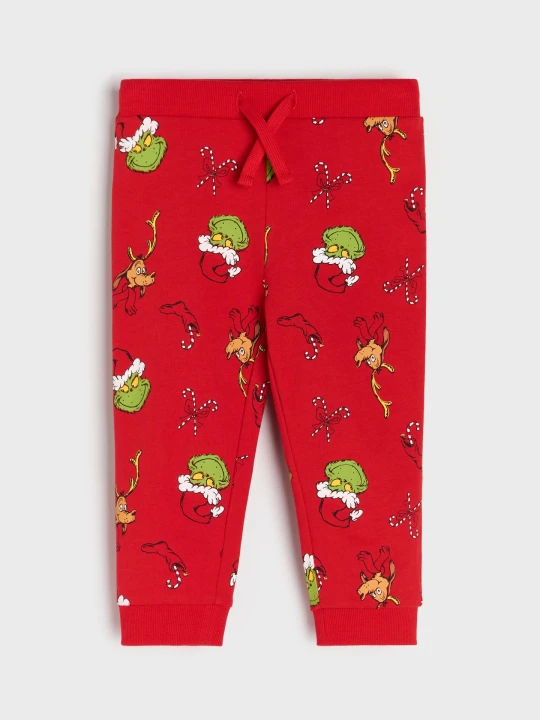 Zdjęcie produktu Sinsay - Spodnie jogger ze wzorem Grinch - czerwony