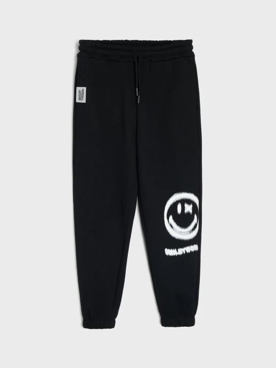 Zdjęcie produktu Sinsay - Spodnie loose z nadrukiem SmileyWorld® - czarny