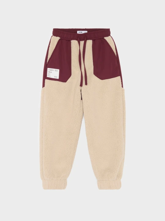 Zdjęcie produktu Sinsay - Sportowe spodnie jogger oversize z tkaniny sherpa z kontrastowymi wstawkami Active - brązowy