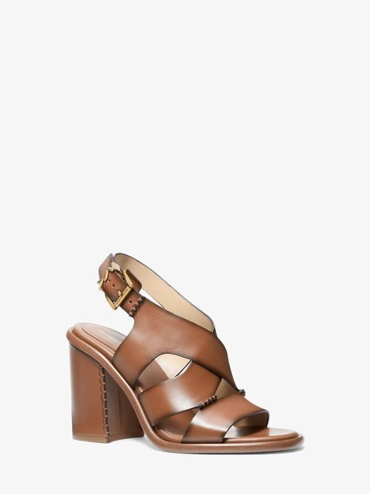 Zdjęcie produktu Skórzane sandały Raven z klockowym obcasem z polerowanej skóry Michael Kors BRĄZOWY (Brązowy)