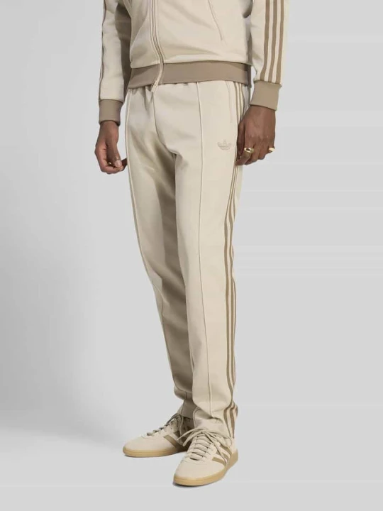 Zdjęcie produktu Slim Fit spodnie dresowe z mieszanki bawełny z kantami adidas Originals Piaskowy