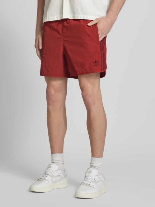 Zdjęcie produktu Spodenki kąpielowe z wyhaftowanym logo model ‘SPRINTER’ adidas Originals Ciemnoczerwony