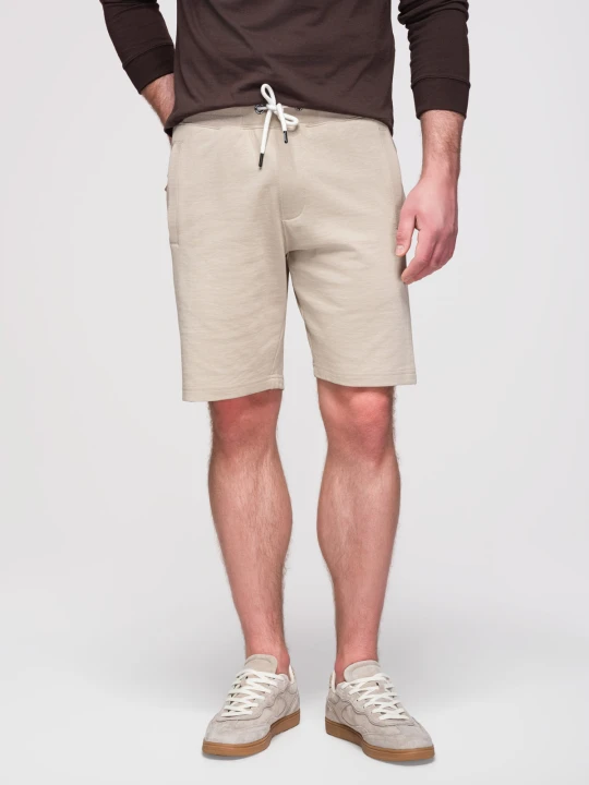 Zdjęcie produktu Spodenki męskie bawełniane ze ściągaczem i kieszeniami - jasnobeżowe V1 - Rozmiar: S Ombre Clothing jasny szary