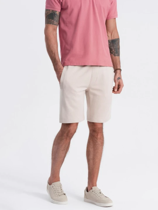 Zdjęcie produktu Spodenki męskie dzianinowe ze ściągaczem i kieszeniami - jasnobeżowe V1 Ombre Clothing beżowy