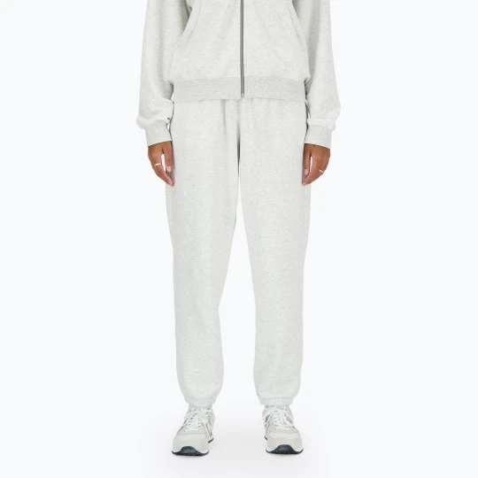 Zdjęcie produktu Spodnie damskie New Balance French Terry Jogger ashheath Szary