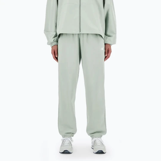 Zdjęcie produktu Spodnie damskie New Balance French Terry Jogger natural mint Zielony