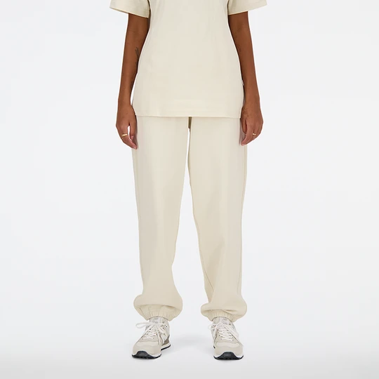 Zdjęcie produktu Spodnie damskie New Balance WP41513LIN – beżowe