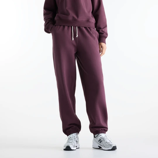 Zdjęcie produktu Spodnie damskie New Balance WP41513YLR – fioletowe