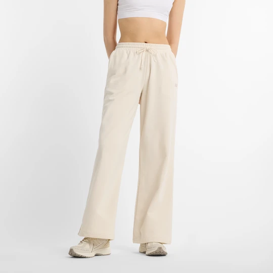Zdjęcie produktu Spodnie damskie New Balance WP51503LIN – beżowe