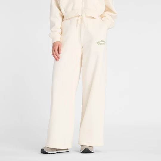 Zdjęcie produktu Spodnie damskie New Balance WP53902PEF – beżowe