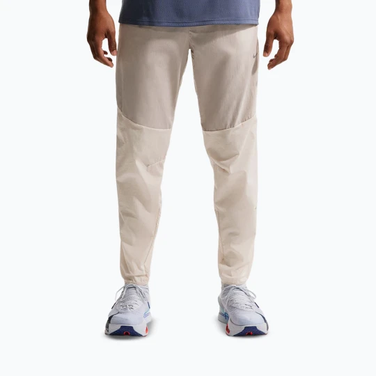 Zdjęcie produktu Spodnie do biegania męskie Nike Stride Repel Woven cream li / birch / natural Beżowy