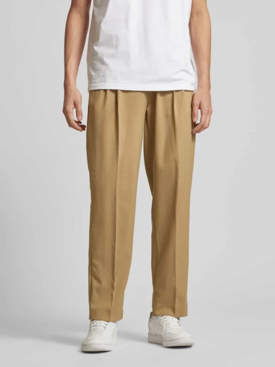 Zdjęcie produktu Spodnie do garnituru o kroju baggy fit z zakładkami w pasie model ‘Julian’ Jack&Jones Beżowy
