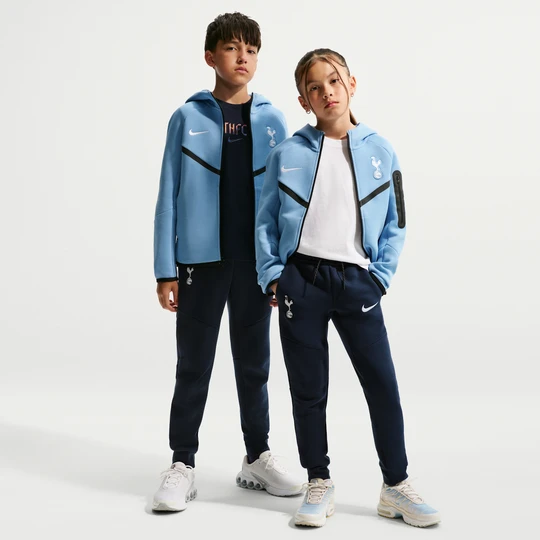 Zdjęcie produktu Spodnie do piłki nożnej dla dużych dzieci (chłopców) Nike Tottenham Hotspur Tech Fleece - Niebieski