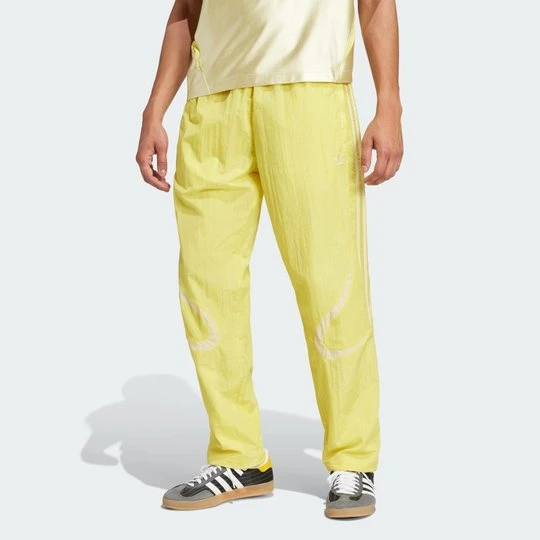Zdjęcie produktu Spodnie dresowe Adicolor 2000s Woven Adidas żółty