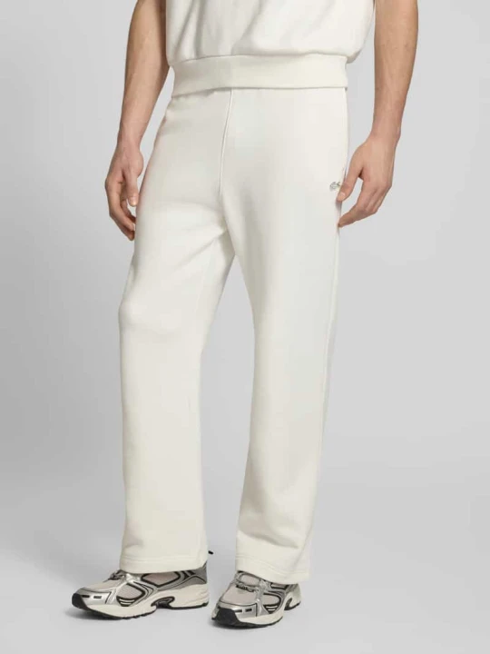 Zdjęcie produktu Spodnie dresowe krój loose fit z czystej Bawełna Lacoste Złamany biały