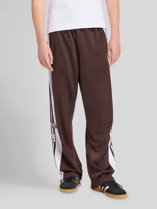 Zdjęcie produktu Spodnie dresowe krój regular fit model 'ADIBREAK' adidas Originals Ciemnobrązowy