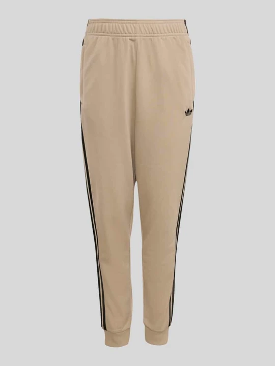 Zdjęcie produktu Spodnie dresowe krój regular fit z koniczyną Trefoil adidas Originals Beżowy