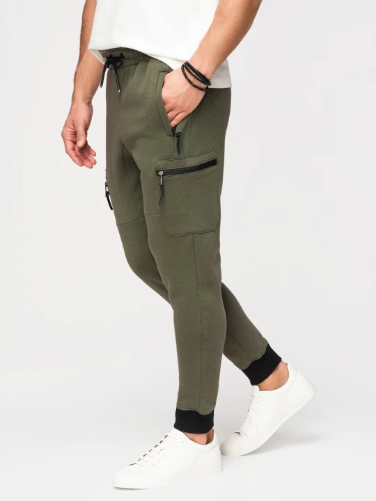 Zdjęcie produktu Spodnie dresowe męskie JOGGER z kieszeniami na udach i kontrastującymi wstawkami - oliwkowe V5 - Rozmiar: XL Ombre Clothing zielony