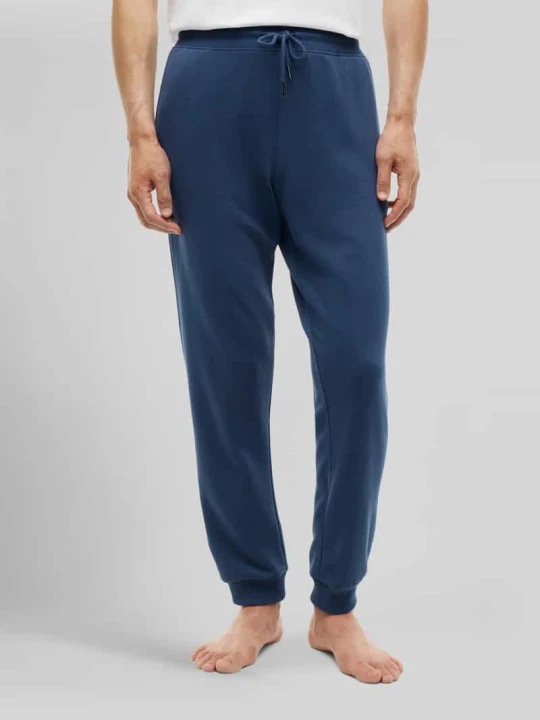 Zdjęcie produktu Spodnie dresowe o kroju regular fit z czystej bawełny z napisem z logo Tommy Hilfiger Niebieski