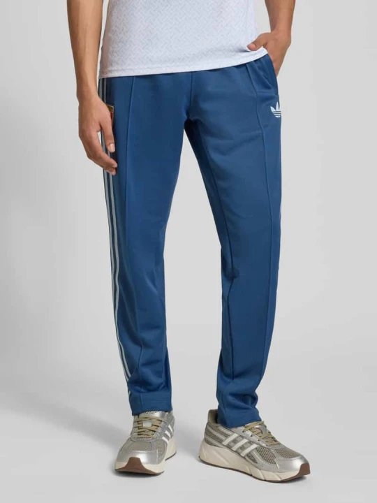 Zdjęcie produktu Spodnie dresowe o kroju regular fit z dodatkiem bawełny, model 'FIGC OG' adidas Originals Granatowy