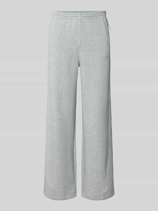 Zdjęcie produktu Spodnie dresowe o kroju regular fit z dodatkiem bawełny Under Armour Jasnoszary melanż